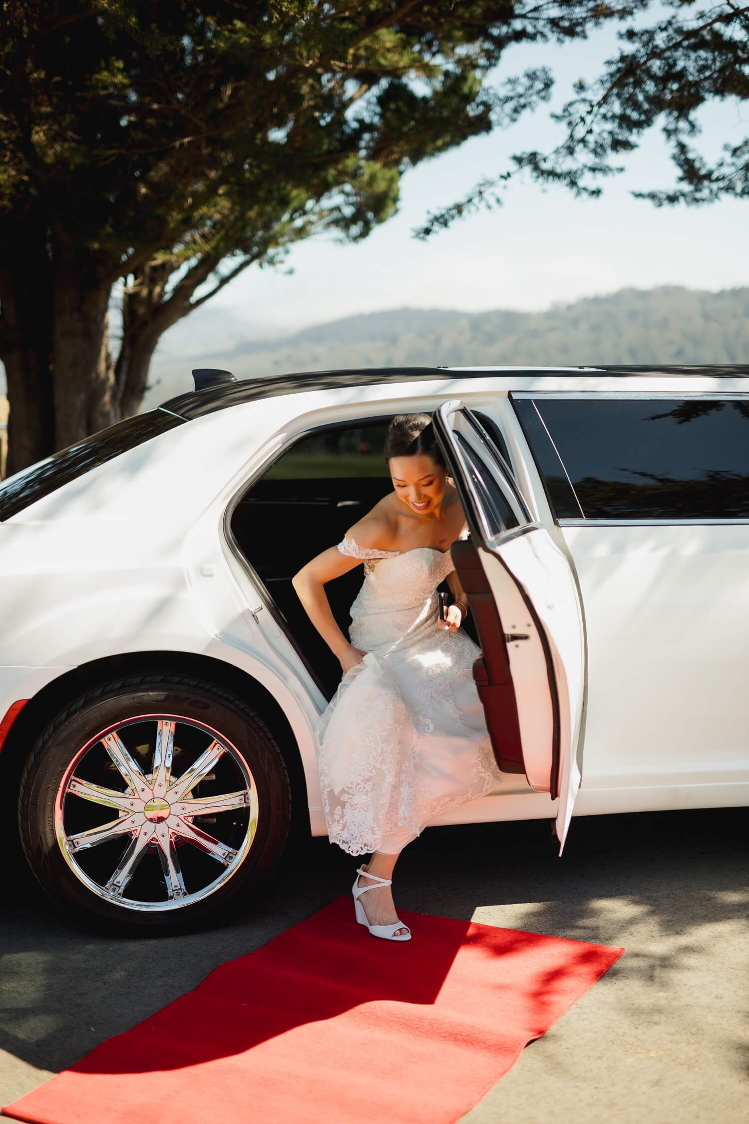 bride climbs out of limo